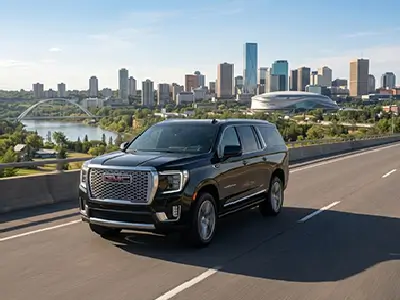 Executive Edmonton Airport Limo 2026 SUV driving toward city skyline